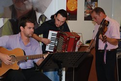 Musicians Florent Jalabert, guitar; Chris Walker, violin; and an accordionist from the crowd who joined in spontaneously. (Click to view larger version...)