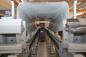 Inside the giant: the divertor cassette approaching the vacuum vessel through the remote handling port. (Click to view larger version...)