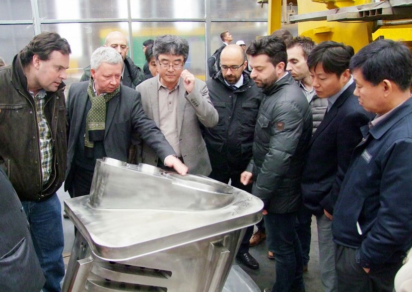 A penetration for in-vessel viewing and divertor cooling pipes at Hyundai Heavy Industries, in Ulsan. From left to right: ITER Vacuum Vessel and Thermal Shield Section Alex Martin, Yuri Utin and Chang-Ho Choi; Emmanuel Verdesio, Project Manager at AMW. (Click to view larger version...)