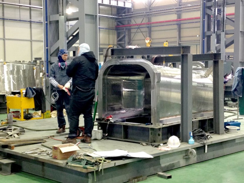 Welding underway on a thermal shield lower port section. The 850-ton thermal shield is made of 600 individual components that range from a few hundred kilos to approximately 10 tonnes. (Click to view larger version...)