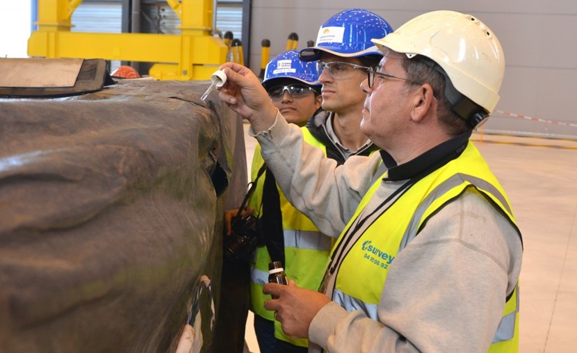 Are the small water puddles that have accumulated on the tarpaulin's surface saline or not? A few drops of diluted silver nitrate will instantly tell. From right to left: Alain Spatafora, the transport expert commissioned by the ITER Organization and DAHER, and cryostat engineers Guillaume Vitupier (ITER Organization) and Mitul Patel (ITER India). (Click to view larger version...)