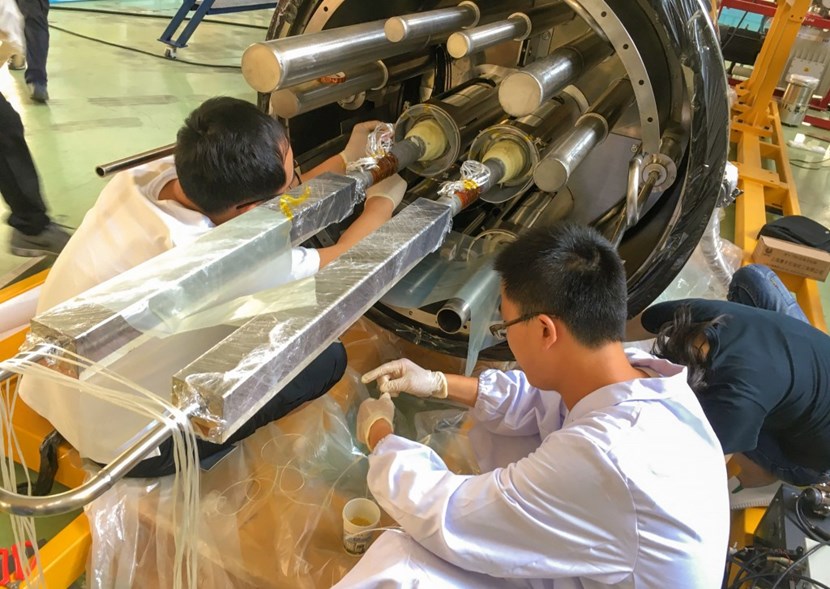 Feeders are the lifeline of the ITER magnet system, relaying electrical power, cryogens, and instrumentation from outside of the cryostat into the powerful coils. (Photo ASIPP) (Click to view larger version...)