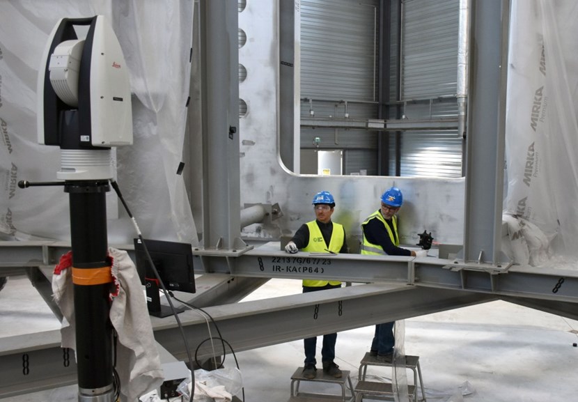 ITER's Lionel Poncet (right) and Giacomo Calchi of the European Domestic Agency Fusion for Energy, F4E, perform a surface scan of a port opening inside the cryostat's lower cylinder. The ITER Organization and F4E enjoy an efficient resource-sharing collaboration in the area of metrology. (Click to view larger version...)