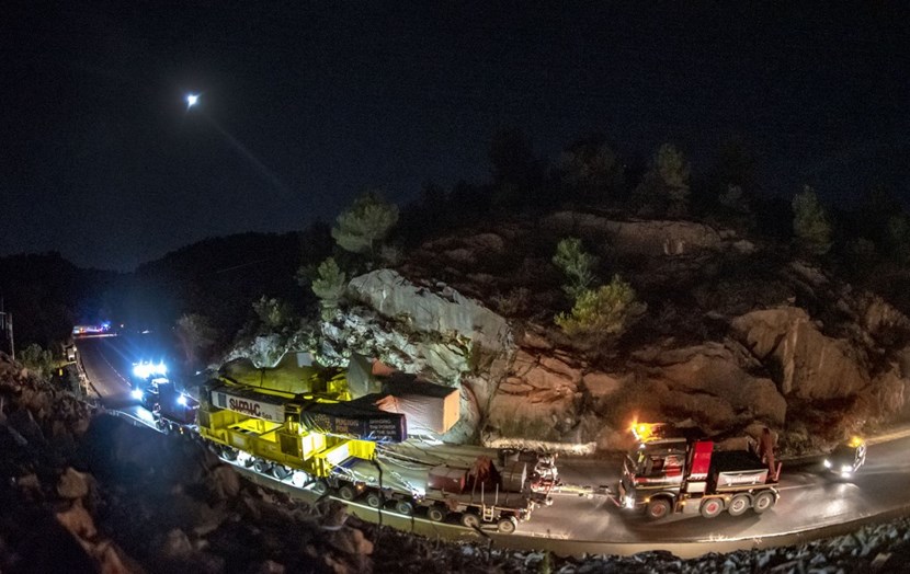 Powered by two 1,000 HP hydraulic ''power packs,'' the trailer transporting toroidal field coil #11 passes through one of the narrowest sections of the ITER Itinerary, a few kilometres to the east of the construction site. (Click to view larger version...)