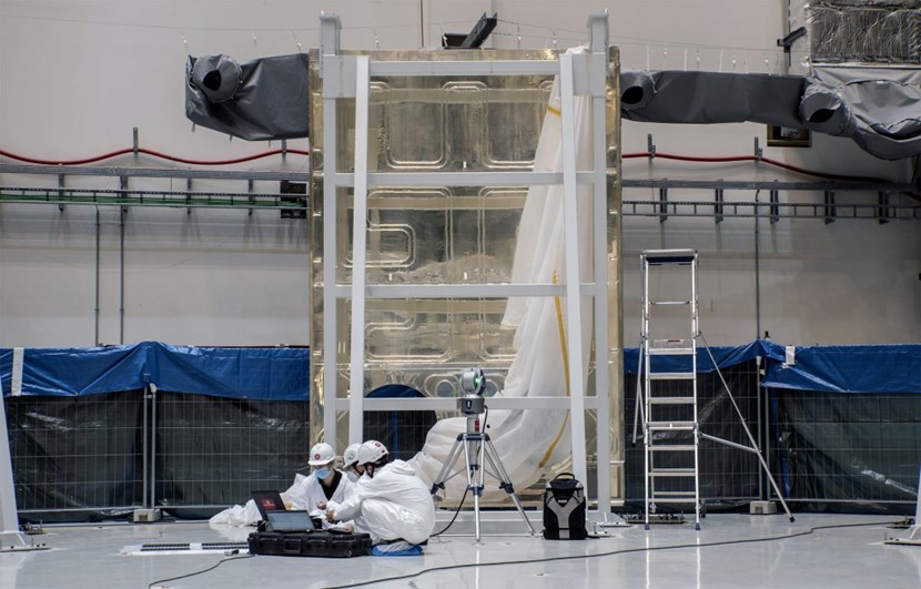 Silver-plated thermal shield panels are being arranged in a circle to form the lower section of the cryostat thermal shield, which should be lowered into the assembly pit in late November. (Click to view larger version...)