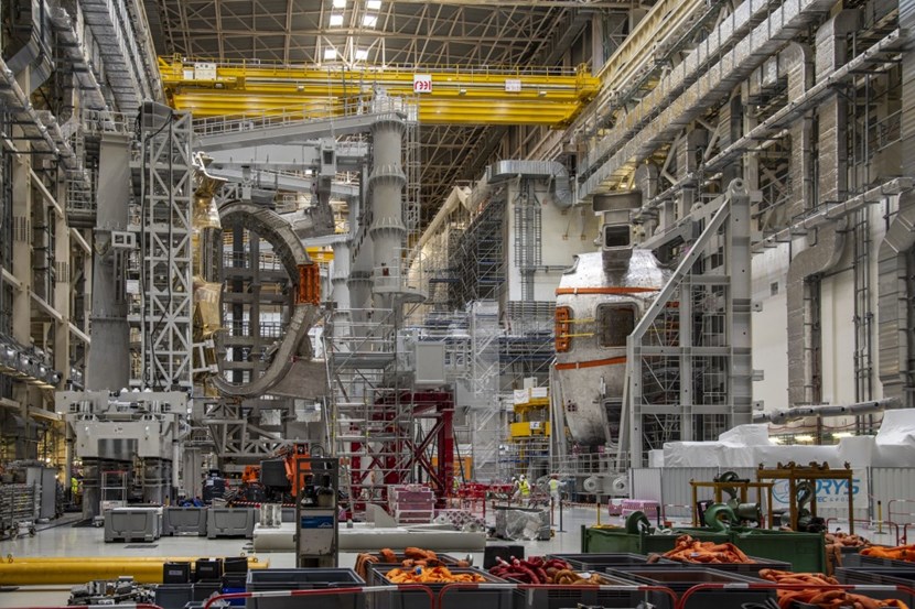 The view inside the Assembly Hall now gives a clear indication of what will happen soon: to the left sector #7 stands in the tall assembly tool SSAT-1, ready for repairs once the outboard thermal shield panel is removed. To the right, sector #8 is solidly attached to the upending tool, waiting to be moved from vertical to horizontal and transported to another building. (Click to view larger version...)