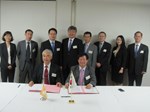 ITER Director-General Osamu Motojima and the Head of the Korean Domestic Agency, Kijung Jung, signing the Procurement Arrangement in the presence of GS Lee, president of the National Fusion Research Institute of Korea and staff members.